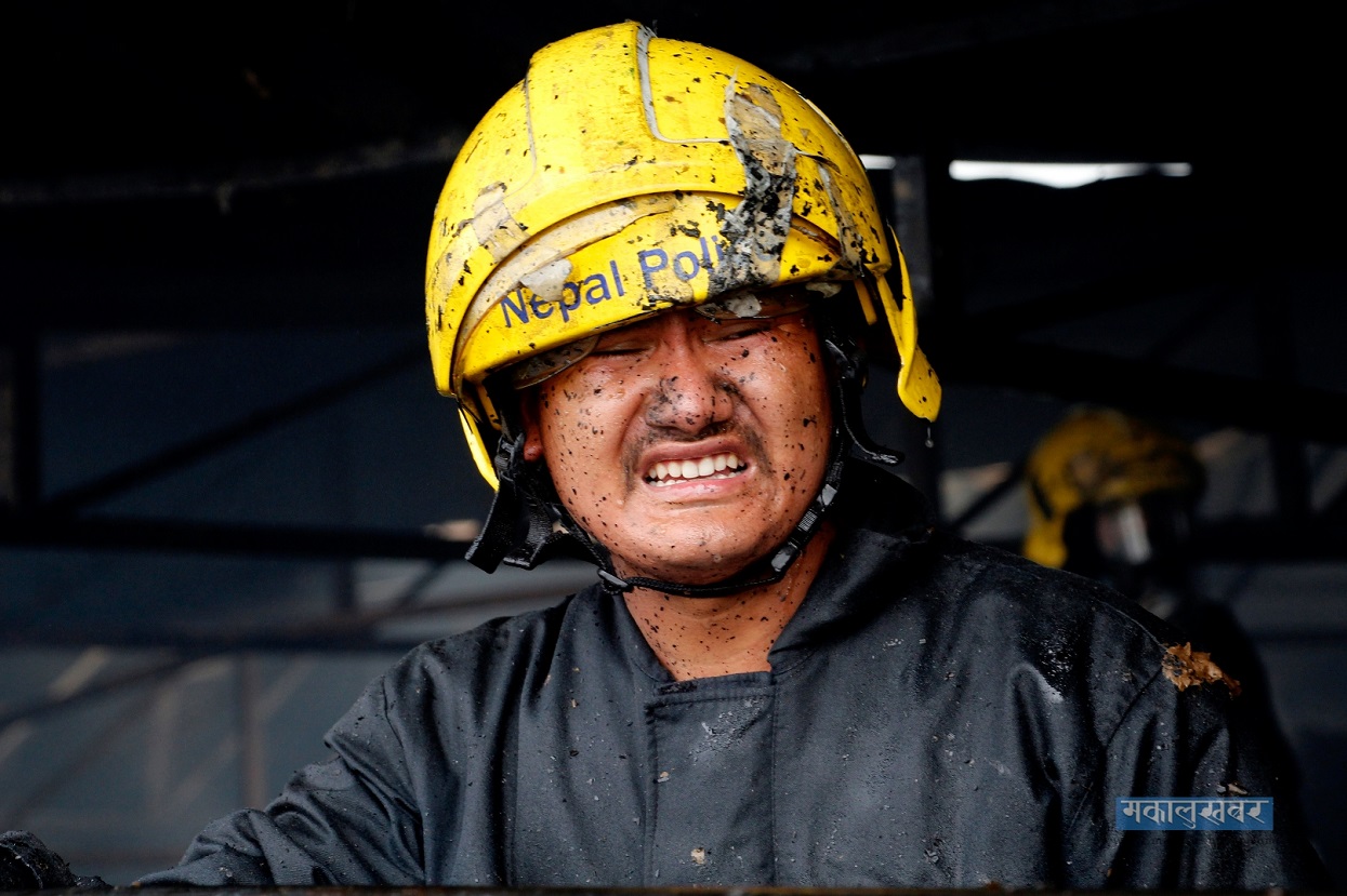 Nepal Police personnel deployed to rescue the fire at Nebico's Biscuit Industry in Balaju Industrial Area.